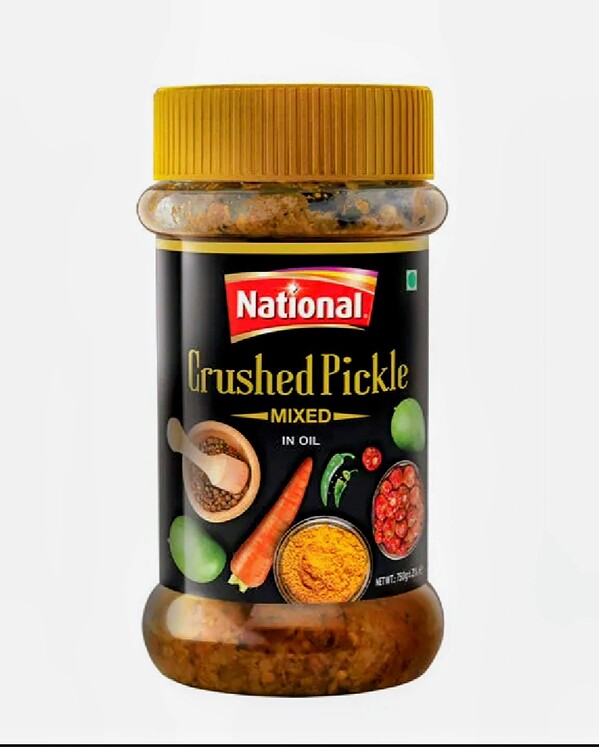 Crushed mixed pickle in oil, authentic tangy and spicy flavor, 750g jar for versatile use.